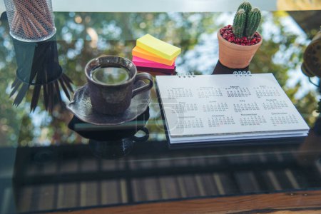 2024 Calendar event planner timetable agenda plan on organize schedule event. Wedding planner agenda organizing timetable by organizer schedule. Calendar desk objects on office table in green park