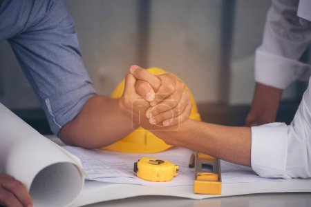 Group of multiracial people Teamwork meeting join hands Engineer Manager Foreman fist bump together. Close up diversity engineer people hands partner teams. Business connection team join partnership