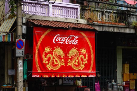 Photo for Red Coca Cola sign with two dragons in Chinatown Bangkok - Royalty Free Image