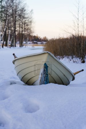 Photo for Rowboat on a beach in winter, close up - Royalty Free Image