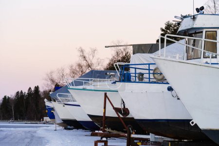 Dry docked boats at the harbor in winter.