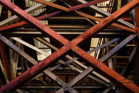 Photo for Red Steel Beams Forming X in Metal Structure - Royalty Free Image