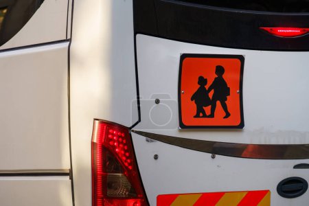 School bus sign on the back of a white minibus, close up. Lisbon, Portugal.