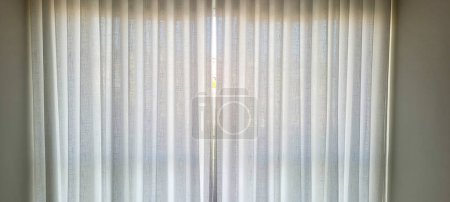"Radiant and welcoming, this sunlit house curtain creates a warm and inviting atmosphere. Purchase this image and illuminate your projects with luminosity and comfort!"