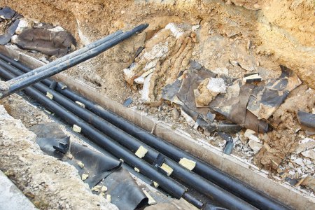 Construction site. Construction of a network of central heating from insulated pipes. Water supply network.
