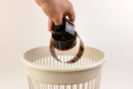 Films are thrown into the trash can. Disposal of household waste.