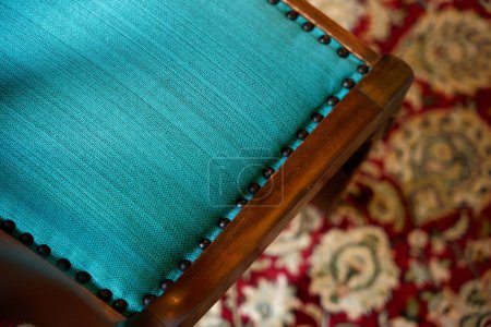 Photo for Upholstery fabric on a chair with a blue fabric, French craftsmanship - Royalty Free Image