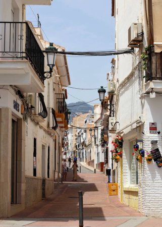 Narrow streets of Nerja in a sunny day