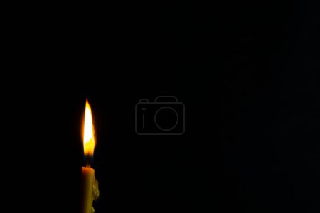 Photo for A slim shape of Candle light of peace in the dark and yellow flame sue as peace elements, yoga, other relaxing. - Royalty Free Image