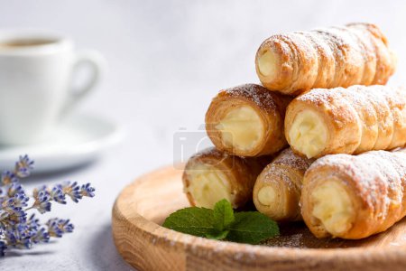 Delicious puff pastry tubes filled with custard