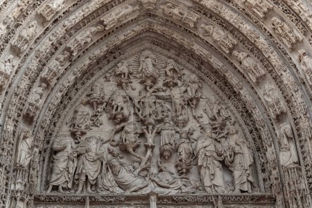 Photo for ROUEN, FRANCE - AUGUST 31, 2019: This is an artistic Gothic lunette of the central portal of the Cathedral. - Royalty Free Image