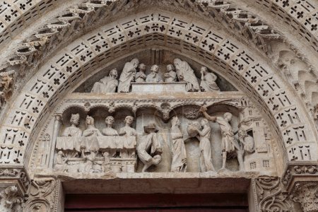 Photo for ROUEN, FRANCE - AUGUST 31, 2019: This is an artistic Gothic lunette of the side portal of the cathedral with scenes from the life of John the Theologian and John the Baptist.. - Royalty Free Image