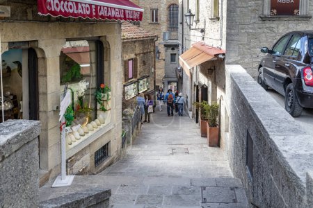 Photo for SAN MARINO, SAN  MARINO - MARTH 11, 2023: This is one of the stairways of the old town with small cafes and shops located on it. - Royalty Free Image