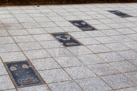 Photo for BUDAPEST, HUNGARY - MARTH 13, 2023: This is a fragment of commemorative slabs with footprints on the Artists' Walk of Fame on Nagymezo Street. - Royalty Free Image