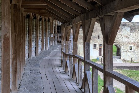 Photo for KAMENETS-PODOLSKY, UKRAINE - APRIL 27, 2023: This is a reconstructed wooden gallery between the towers along the fortress walls of the Kamenets-Podolsky Fortress. - Royalty Free Image