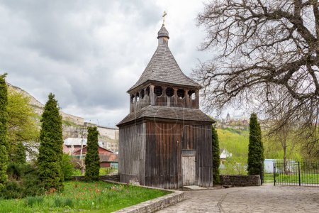 Photo for KAMENETS-PODOLSKY, UKRAINE - APRIL 27, 2023: This is the wooden bell tower of the Church of the Exaltation of the Cross (XIX century). - Royalty Free Image