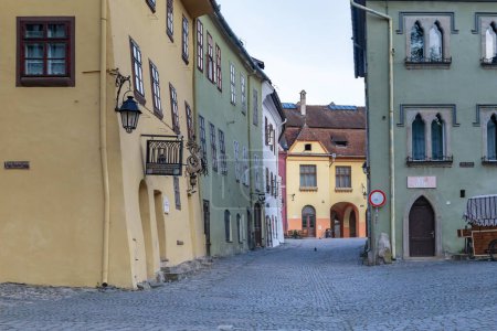 Photo for SIGHISOARA, ROMANIA - MAY 2, 2023: This is the passage between Museum Square and Citadel Square in the medieval town inside the walls of the citadel. - Royalty Free Image