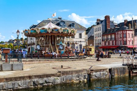 Photo for HONFLEUR, FRANCE - SEPTEMBER 1, 2019: This is an amusement park with a classic carousel on the Hotel de Ville Square. - Royalty Free Image