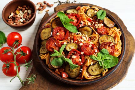 Photo for Vegetarian pasta with eggplant and tomatoes in vegetable sauce. Delicious healthy food - Royalty Free Image