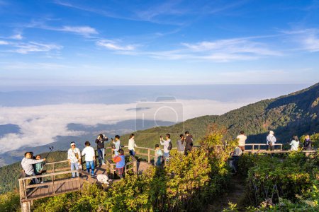 Photo for Chiang Mai, Thailand - 2 November 2022 - Visitors taking their morning sunrise pictures at the viewpoint area of the beautiful Kew Mae Pan Nature Trail on Doi Inthanon mountain in Chiang Mai, Thailand - Royalty Free Image