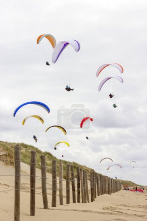 Photo for Paragliding at the sea side, Netherlands, North Sea - Royalty Free Image