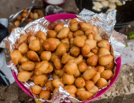 Photo for A bowl of freshly fried flour balls widely called puff puff in Nigeria - Royalty Free Image