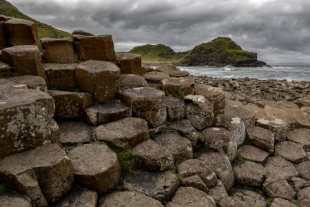 Photo for Basalt columns of Giants Causeway in Ireland under dramatic sky. - Royalty Free Image