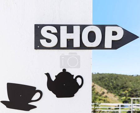 Photo for Coffee arrow sign in Mertola, Portugal. Colors of Portugal Series - Royalty Free Image