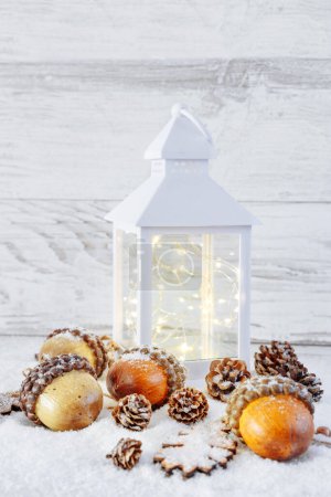 Photo for Christmas Lantern with decorations on wooden background with snow - Royalty Free Image