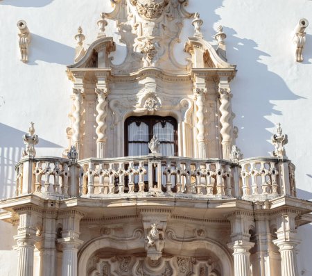 Photo for Beautiful baroque balcony of the Marques de la Gomera Palace in Osuna. Ducal town declared a Historic-Artistic Site. Southern Spain. Picturesque travel destination on Spain. - Royalty Free Image
