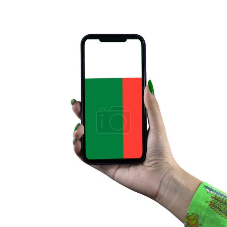 Photo for The Madagascar Flag display in a smartphone held by a young Asian female or woman's hand. Patriotism with modern cellphone technology display. Isolated on a white background. - Royalty Free Image