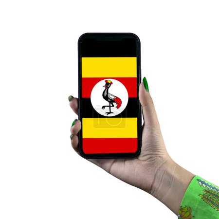 The Uganda flag is displayed on a smartphone held by a young Asian female or woman's hand. Isolated on a white background. Patriotism with modern cellphone technology display.