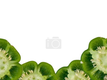 Foto de Vista superior del pimiento Rebanada de chile verde asiático cortada aislada sobre fondo blanco. 'Shimla Mirch Sabzi' en idioma Hindi. - Imagen libre de derechos