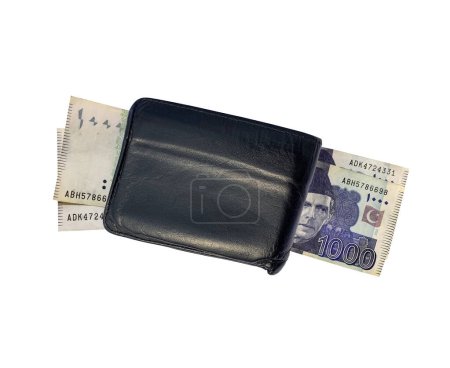 Top view of black leather wallet with one thousand Pakistani currency bank notes. Isolated on a white background. 14 February 2024.