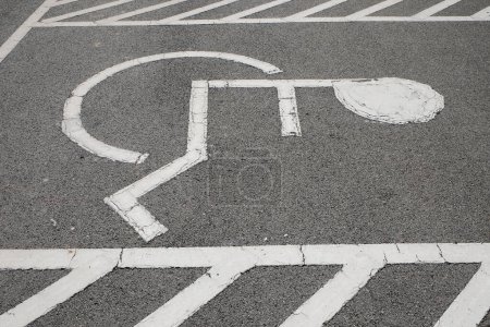 Photo for Handicapped parking reserved for the disabled in outdoor lot for the publi - Royalty Free Image
