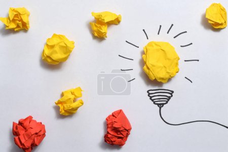 Creative idea, Inspiration, New idea and Innovation concept with Crumpled Paper light bulb on white background.