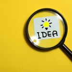 soft focus, Creative idea concept, magnifying glass and light bulb icon with yellow background