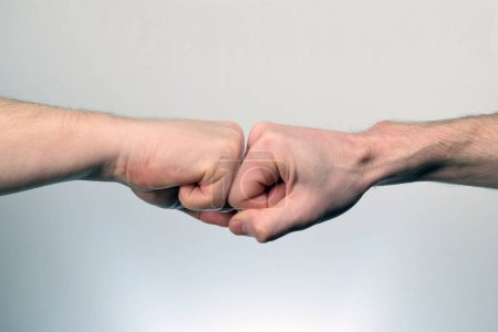 Photo for Fist Bump. Clash of two fists. Concept of confrontation - Royalty Free Image