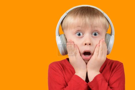 Photo for Little child listening to music - Royalty Free Image