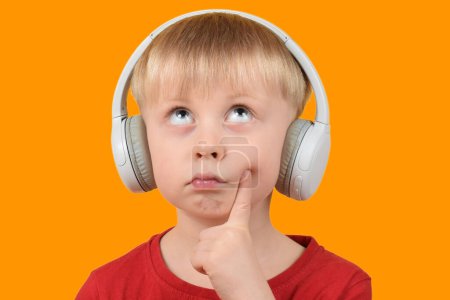 Photo for Little child listening to music - Royalty Free Image