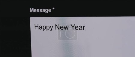 Photo for Typing Happy New Year in email - Royalty Free Image