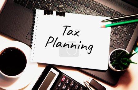 Photo for Tax Planning word is written on white piece of paper - Royalty Free Image