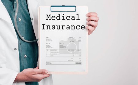 Photo for Doctor holding Paper Pad with Text Medical Insurance - Royalty Free Image
