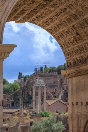 Photo for View of the Roman Forum through the Triumphal Arch of Septimius Severus in Rome, Italy. - Royalty Free Image
