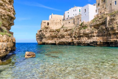Photo for Polignano a Mare: Cala Monachile Beach in Italy (Apulia). It is located in the center of Polignano, a few steps away from the historic center - Royalty Free Image