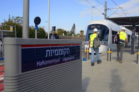 Photo for Bat Yam, ISRAEL. December 2022 Dankal metro tram. Tel Aviv light Rail. White locomotives on test drive. Metropolitan area in central Israel. Translate: Hakomemiyut - Royalty Free Image