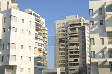 Beautiful white residential buildings. Modern area, new buildings. Real estate in Israel. Tenement house