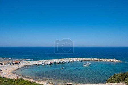 Photo for Mediterranean Sea harbor boasting beautiful blue waters at Agios Georgios Pegeias, Paphos, island of Cyprus - Royalty Free Image
