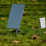 Ukraine, Kherson - November 14, 2022: A SpaceX Starlink satellite dish stands on a green lawn in the city center for free distribution of the Internet to citizens