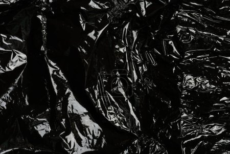 Téléchargez les photos : Polyéthylène noir froissé, cadre complet - en image libre de droit